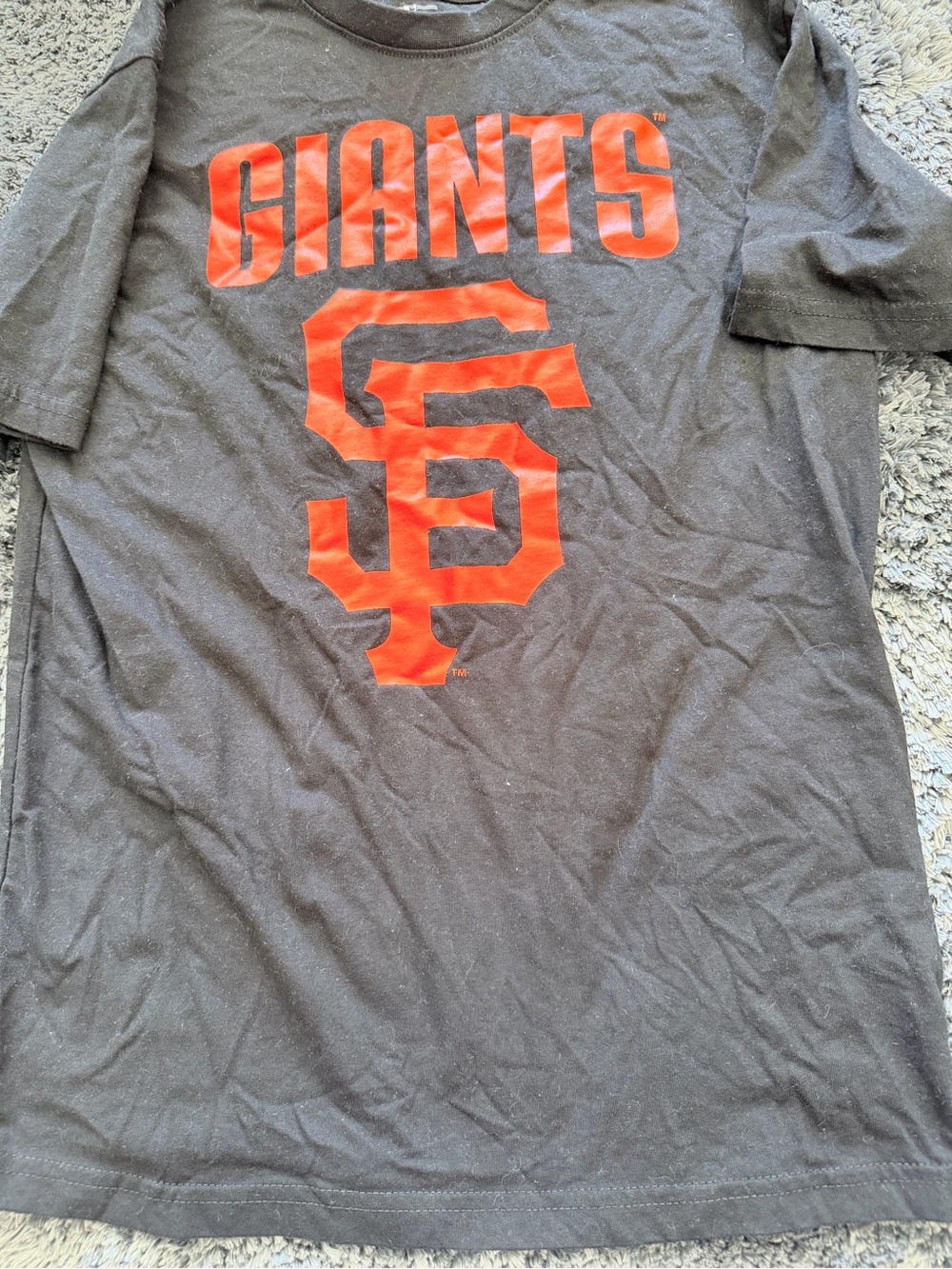 Genuine Merchandise Black Tee with Orange Graphic